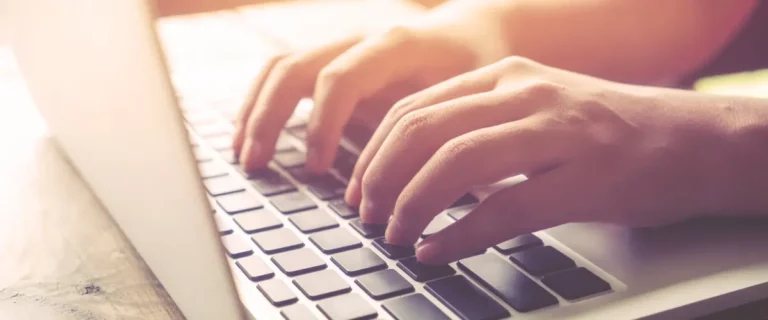 typing on laptop